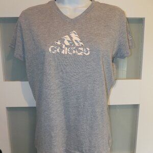 The product is a women's Adidas short sleeve shirt in size M, featuring a gray c